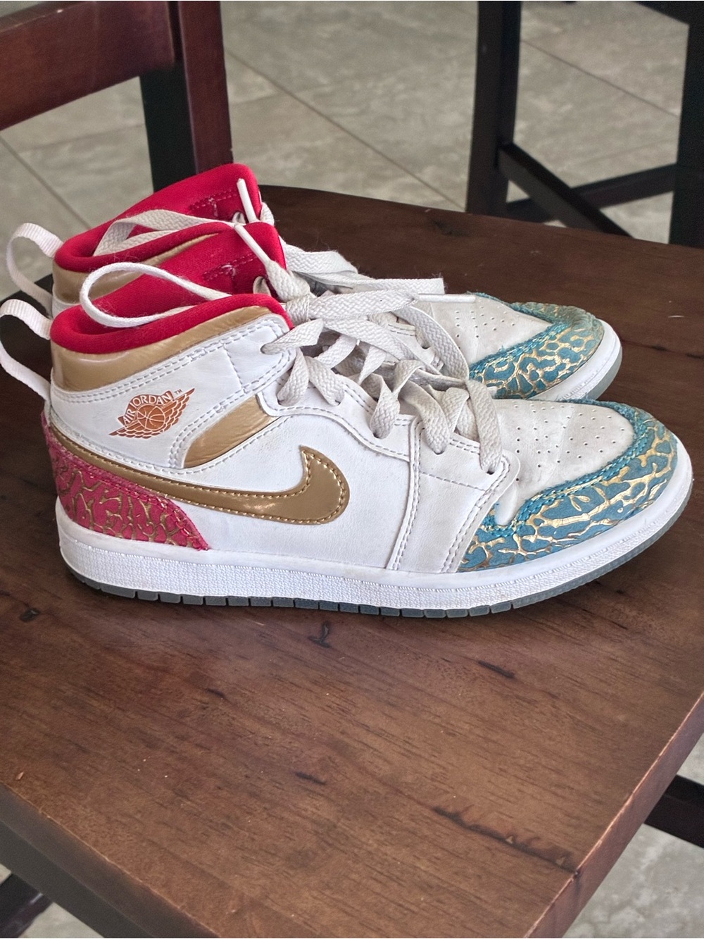 Jordan Kids Mid-Top Sneakers in White with Gold, Red & Teal Accents